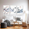 Three-panel Japanese ink wash cherry blossom wall art displayed above a white sofa