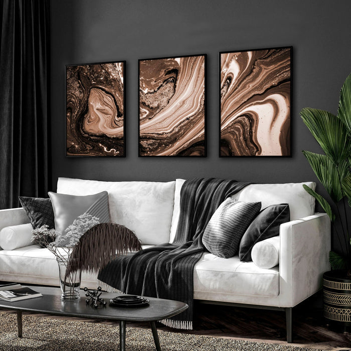 Contemporary living room with three framed copper wall art prints above a cream sofa