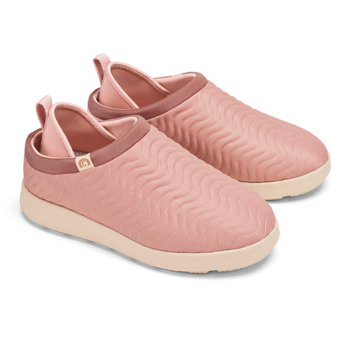 Pair of pink slip-on shoes with wavy pattern on a white background #color_mauve