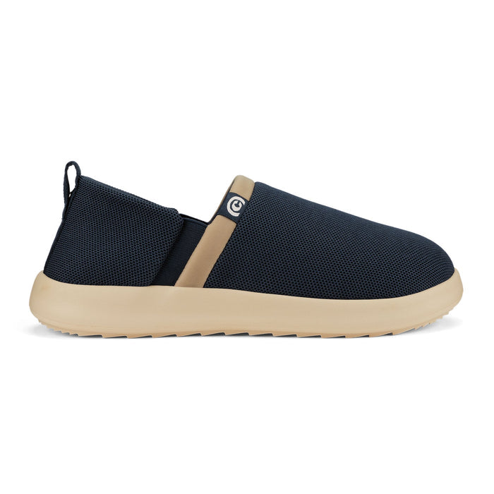 Navy slip-on shoe with beige sole on a white background. #color_navy