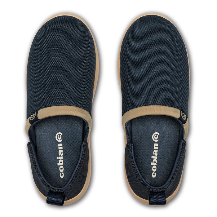 Pair of black and beige slip-on shoes with 'cobian' branding on a white background #color_navy