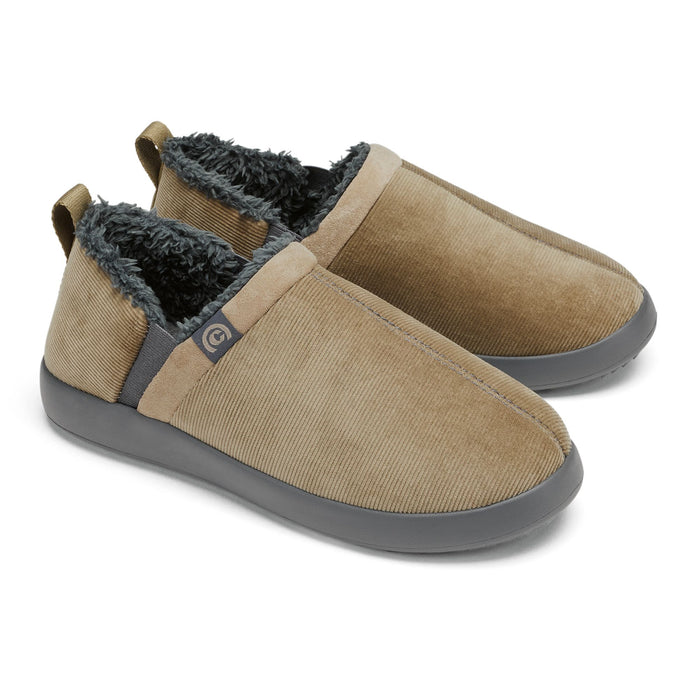 A pair of slip-on indoor slippers in tan corduroy with a dark gray sole and a plush black fleece lining, shown on a white background. #color_taupe