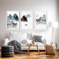 Modern living room featuring three framed japandi wall art prints above a white sofa with minimalist décor