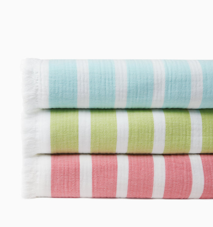 Merlata beach blankets in clearwater, kiwi & coral stacked