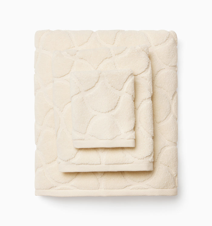 Oasi ivory bath towel, hand towel, and wascloth folded and stacked