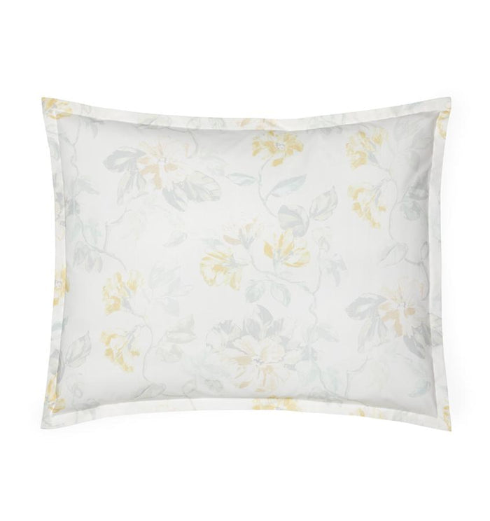White cotton percale sham with a light yellow floral motif against a white background.
