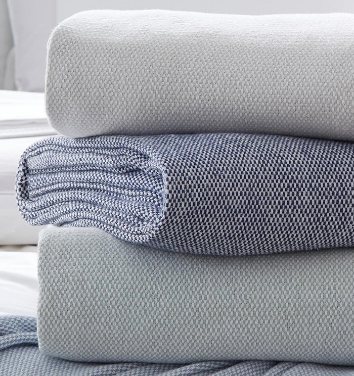 SFERRA Terzo pillows and throws feature a classic basket weave pattern in soft, versatile colors that are welcoming in any room.