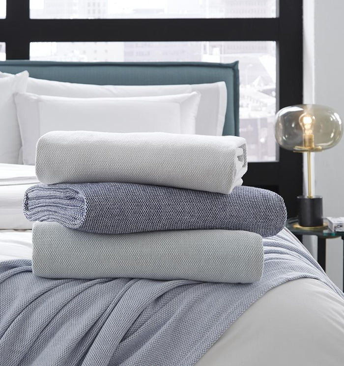 SFERRA Terzo pillows and throws feature a classic basket weave pattern in soft, versatile colors that are welcoming in any room.