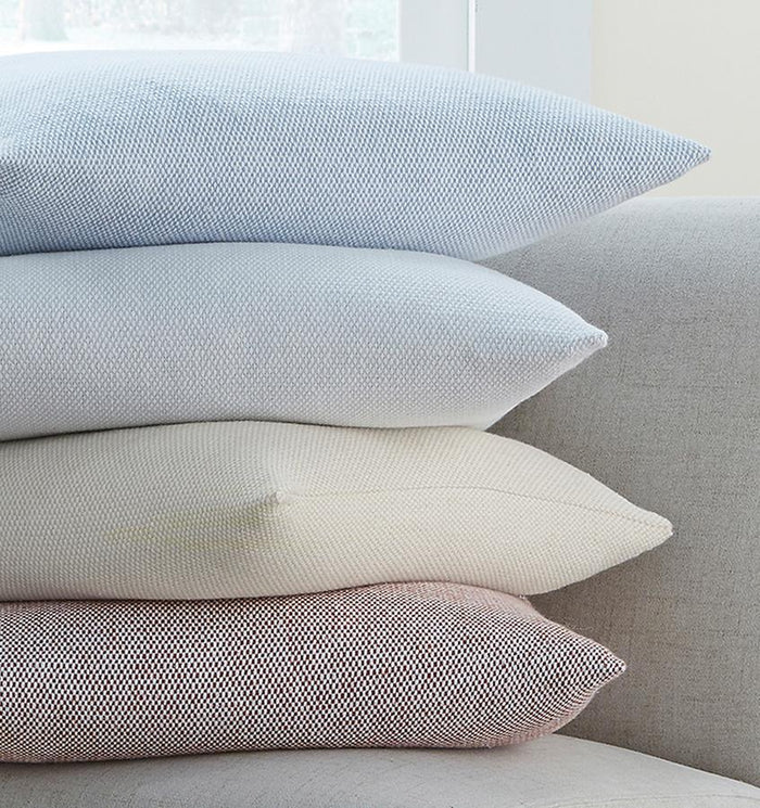 Terzo pillows and throws feature a classic basket weave pattern in soft, versatile colors.