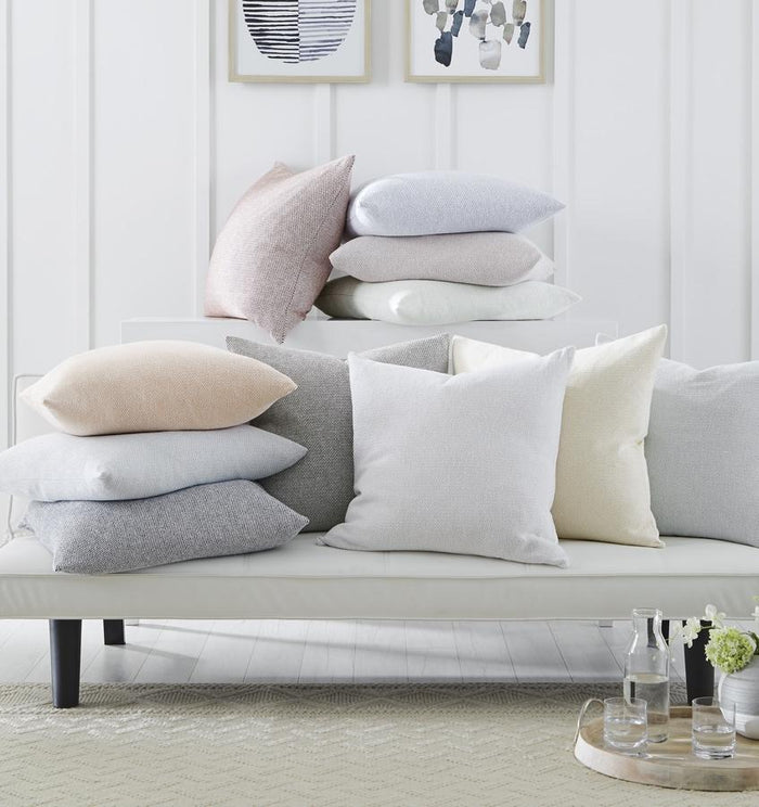 Terzo pillows and throws feature a classic basket weave pattern in soft, versatile colors.