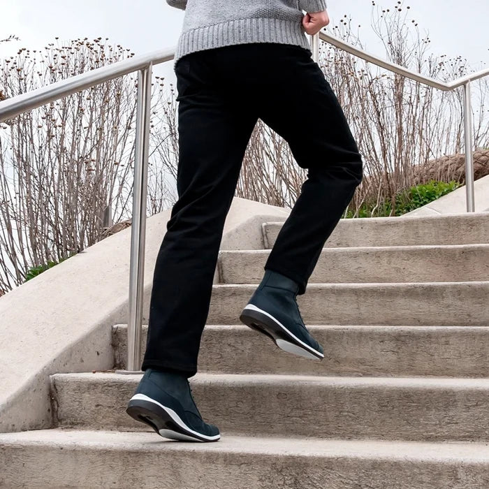 model jogging wearing The Boot in Cobalt blue Nubuck