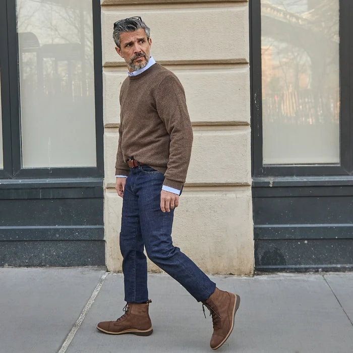 Model wearing the boot copper with dark jeans and sweater