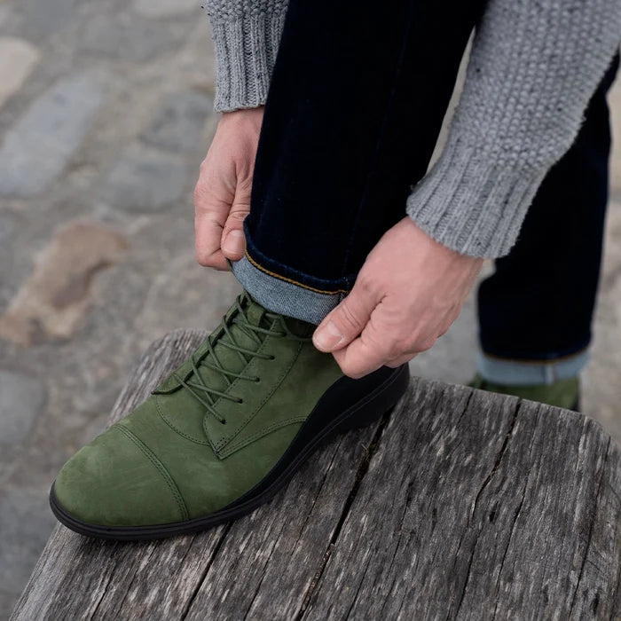 model wearing The Boot in Olive green Nubuck