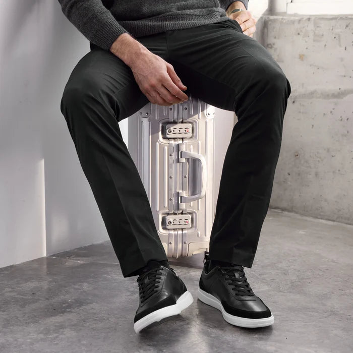 Model wearing The Court in Onyx leather & suede with black pants and gray sweater