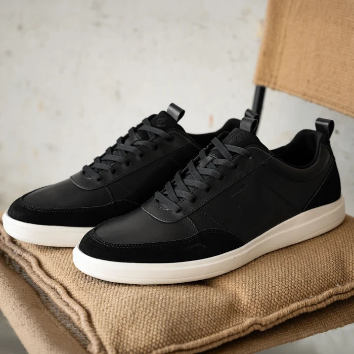 Detail shot of The Court in Onyx leather & suede on chair