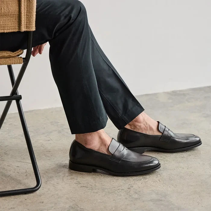 Model wearing The Duke in Obsidian black full-grain leather with dark dress pants