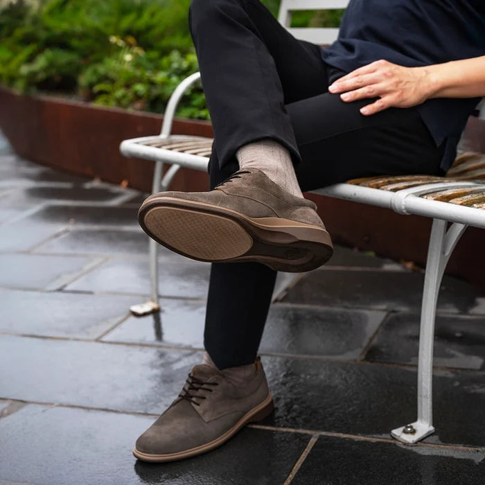 model sitting on bench wearing The Original Slate paired with black dress pants