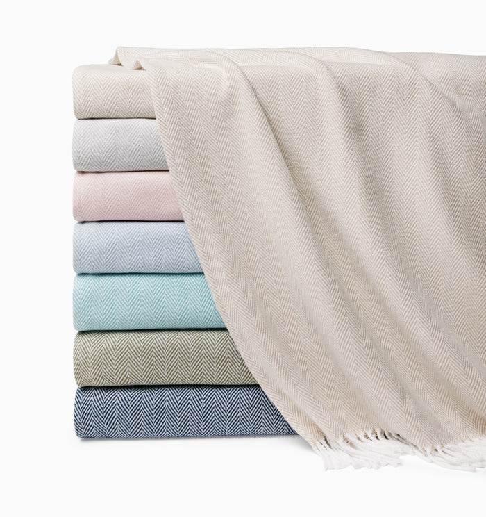 Celine throw stacked showing various colors