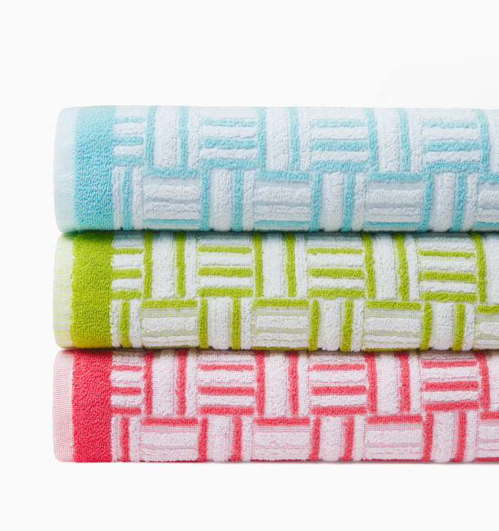 Stack of the Tirreno beach towels top to bottom clearwater, kiwi, coral
