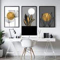 Contemporary wall art desk workspace with golden botanical line drawings above white desk
