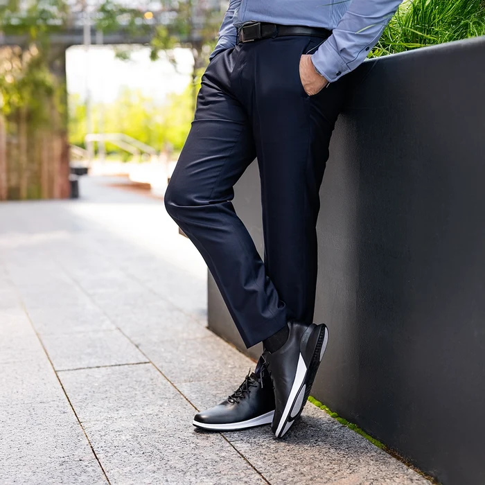 Whole Cut Hybrid Onyx worn by model wearing dark blue dress pants and button up shirt